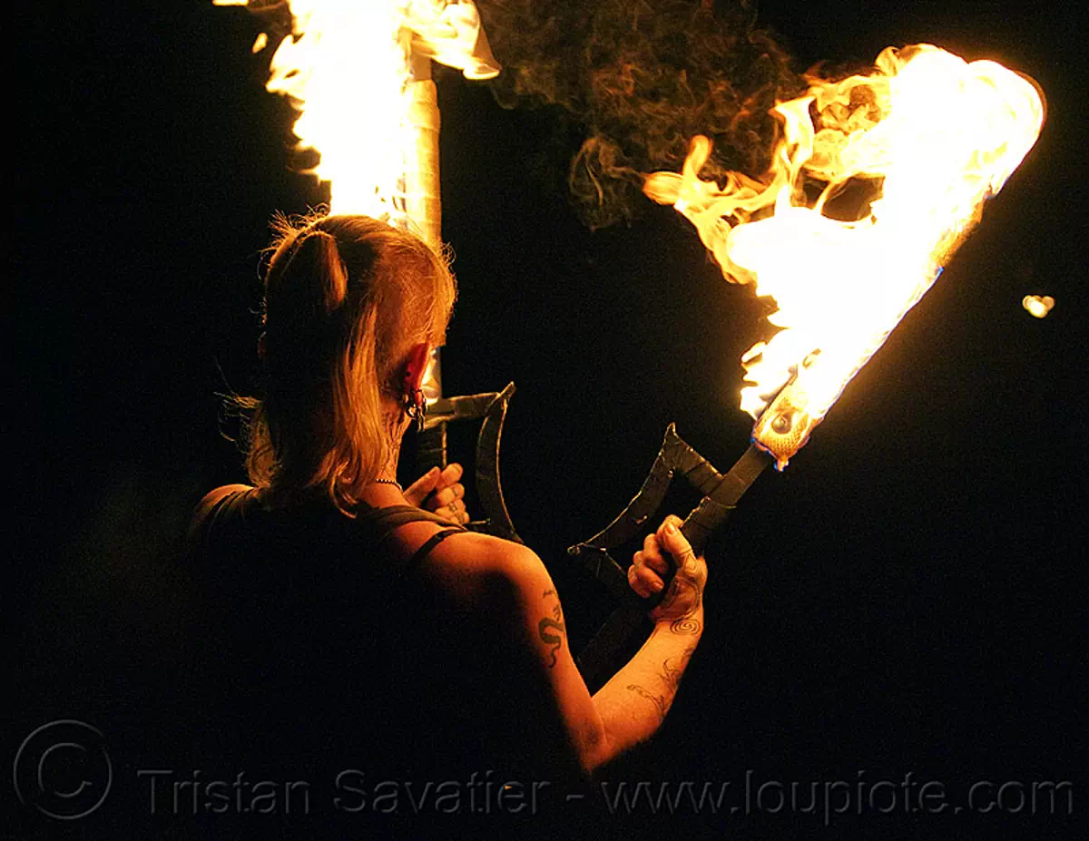 A Dance Of Swords In The Night fire performer with fire swords