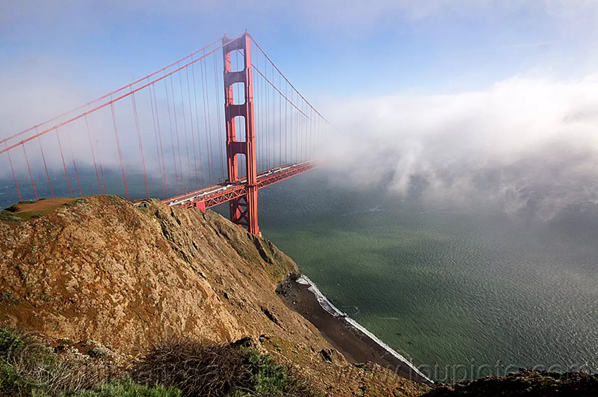 golden gate bridge in the fog - view from the spencer battery (san francisco), beach, bridge tower, cliff, fog, golden gate bridge, seashore, suspension bridge