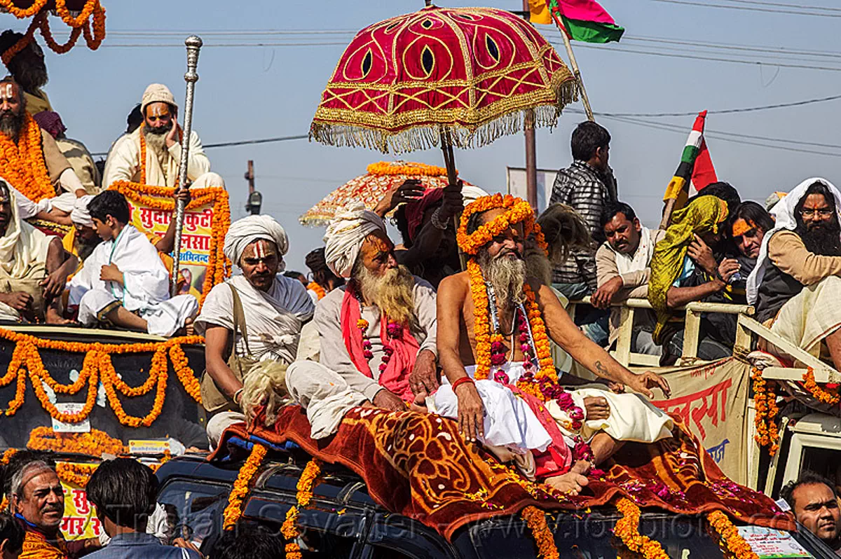 gurus and babas parade on decorated cars - kumbh mela 2013 (india), babas, beard, crowd, float, gurus, hindu pilgrimage, hinduism, kumbh maha snan, kumbh mela, mauni amavasya, men, parade, umbrellas