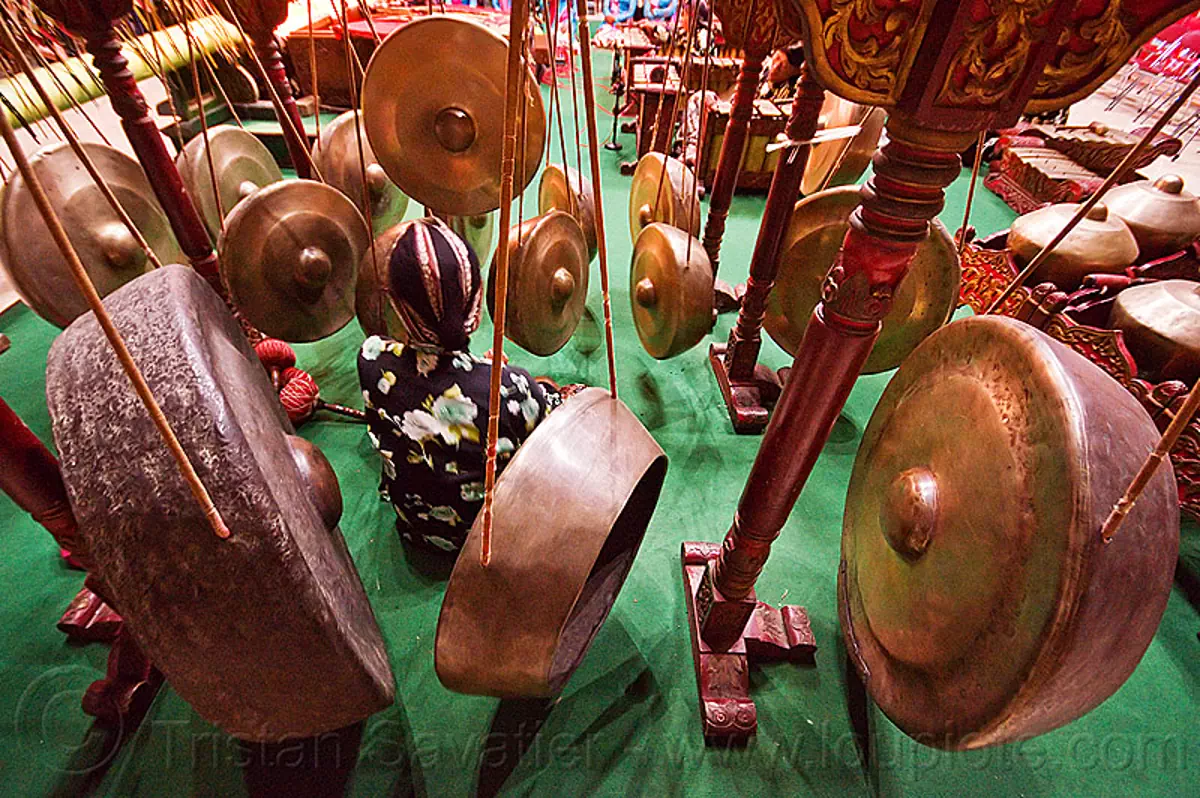 hanging gongs - gamelan ensemble, bossed gongs, gamelan ensemble, gong ageng, gong group, hanging gongs, karawitan, man, music, musical, nipple gongs, percussion, player, ropes, sitting, suspended gongs