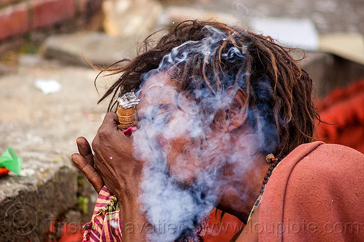hindu devotee smoking a chillum of weed - ritual cannabis (nepal), baba smoking chillum, dreadlocks, ganja, hindu, hinduism, kathmandu, maha shivaratri, man, pashupatinath, sadhu, smoking pipe, smoking weed, thick smoke