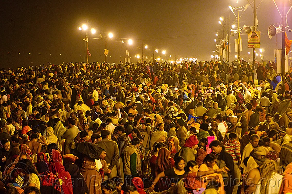 huge crowd of hindu pilgrims gathering at sangam for the holy bath in the ganges river - kumbh mela 2013 (india), crowd, hindu pilgrimage, hinduism, kumbh mela, men, night, paush purnima, pilgrims, street lights, triveni sangam, women