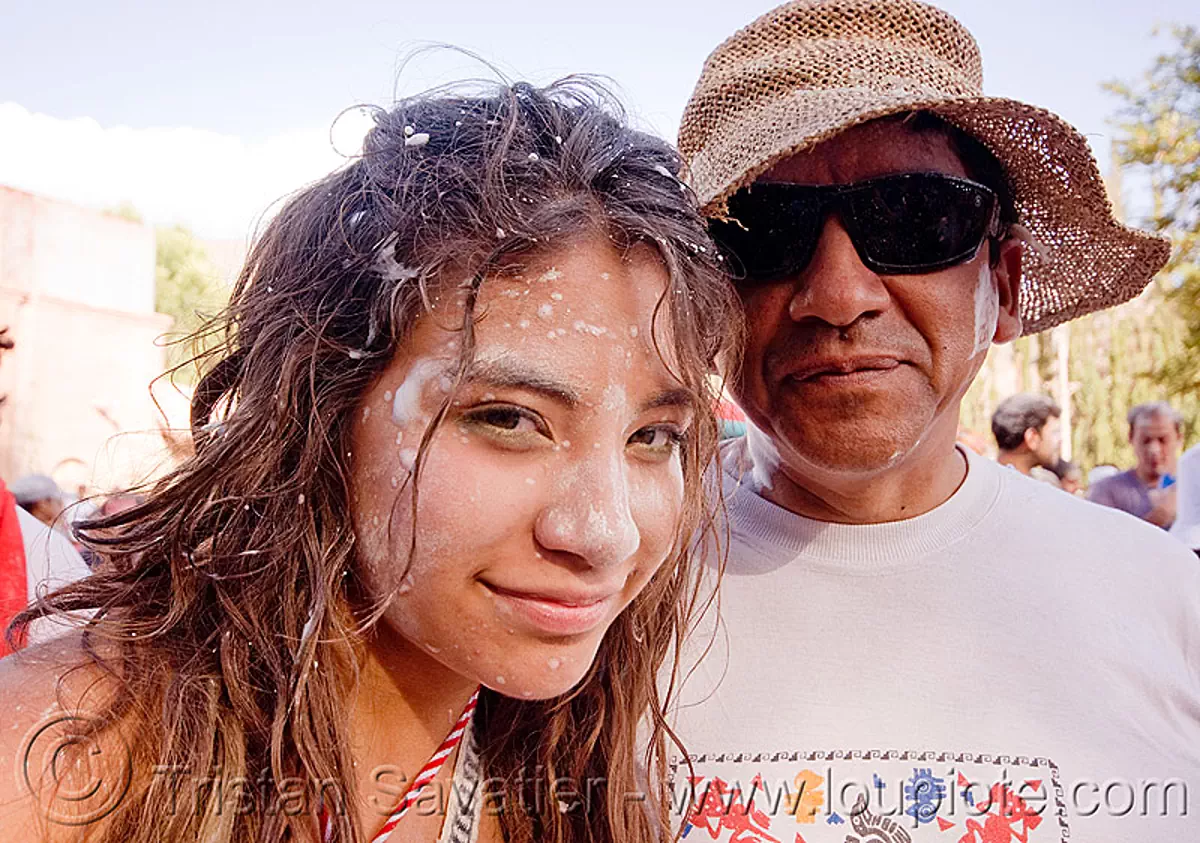 indigenous quechua father and daughter at the carnaval de tilcara (argentina), andean carnival, argentina, daughter, father, man, noroeste argentino, quebrada de humahuaca, quechua, tilcara, woman