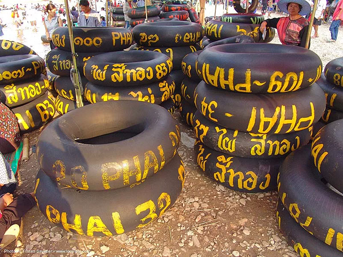 inner tubes with yellow paint markings, river tubing, thailand