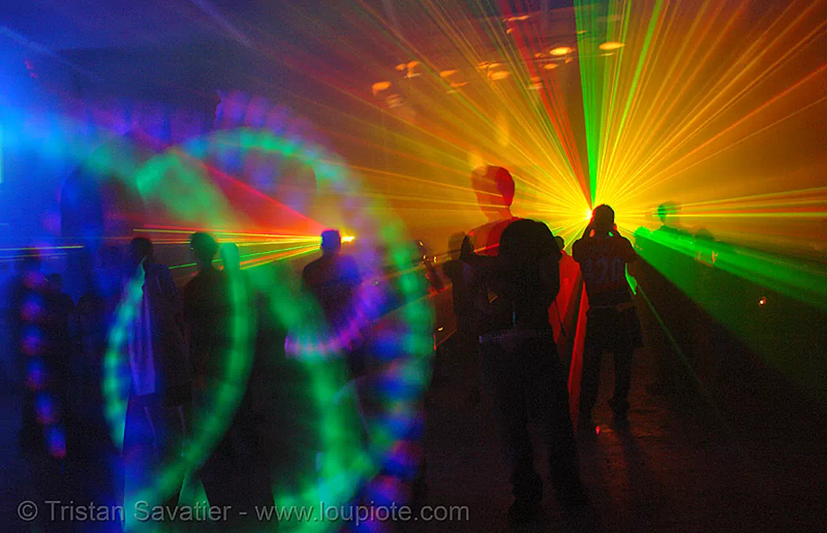 laser show - lights and shadows in warehouse underground rave party, backlight, glowing, laser lightshow, laser show, lasers, led lights, night, nightclub, nightlife, rave lights, ravers, silhouettes