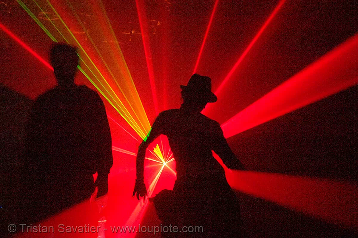laser show - shadows dancing in warehouse underground rave party, backlight, laser lightshow, laser show, lasers, nightclub, nightlife, rave lights, ravers, red, silhouettes