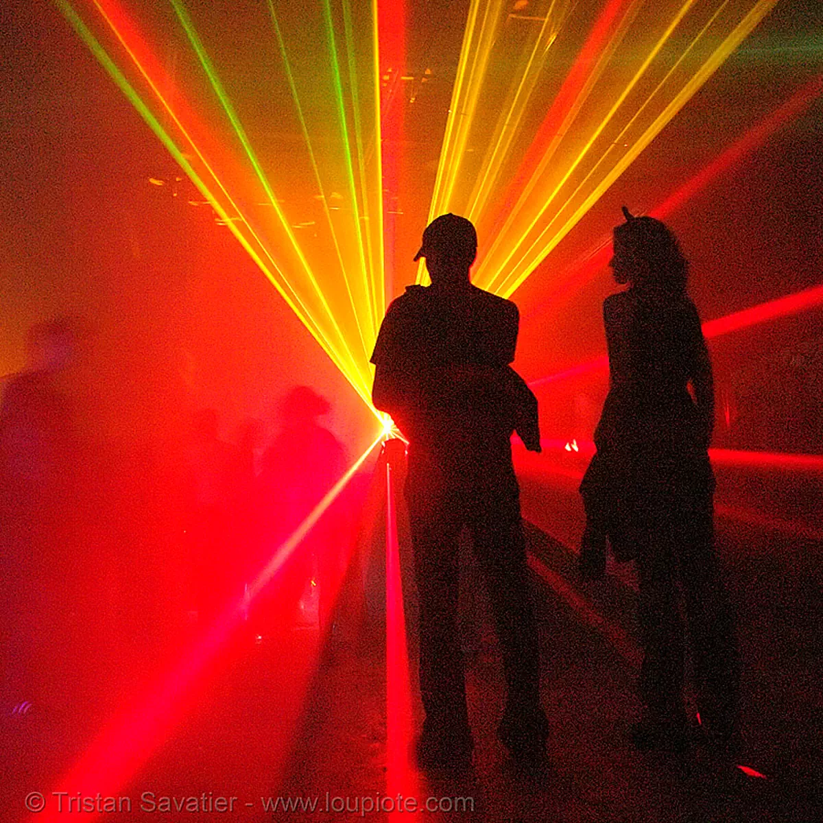 laser show, shadows in underground rave party