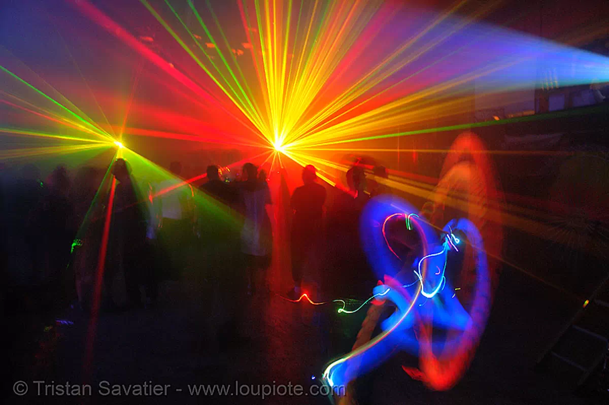 laser show, shadows in warehouse underground rave party