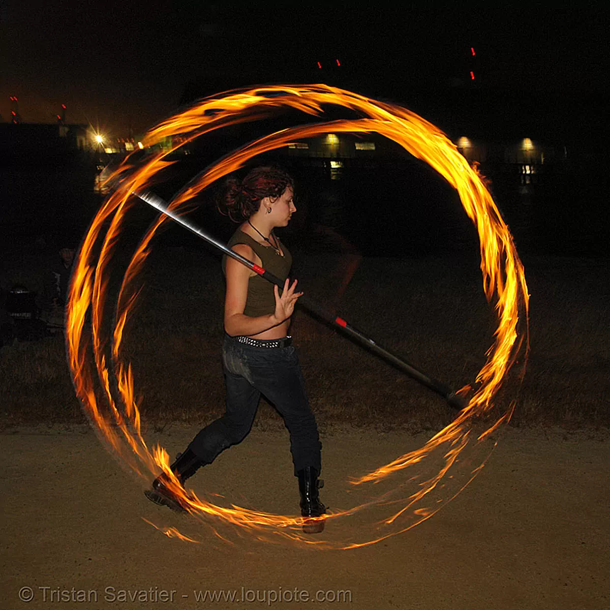 lexie spinning a fire staff