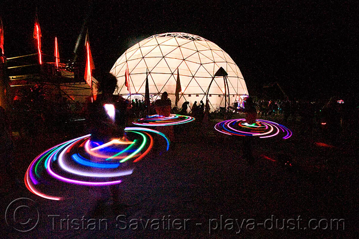 light hoopers near root society dome - burning man 2008, burning man, geodesic dome, glowing, hooper, hula hoop, led hoop, led lights, light hoop, night, root society