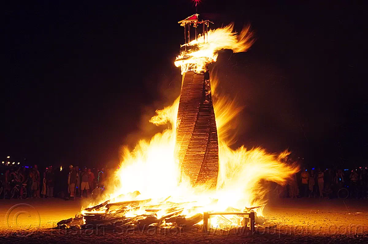 lighthouse on fire - burning man 2012, burning man, c.o.r.e., circle of regional effigies, core project, fire, lighthouse, night, tower, twisted upright house