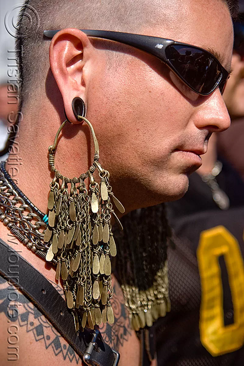 man with large brass earring, dore alley fair, san francisco Stock
