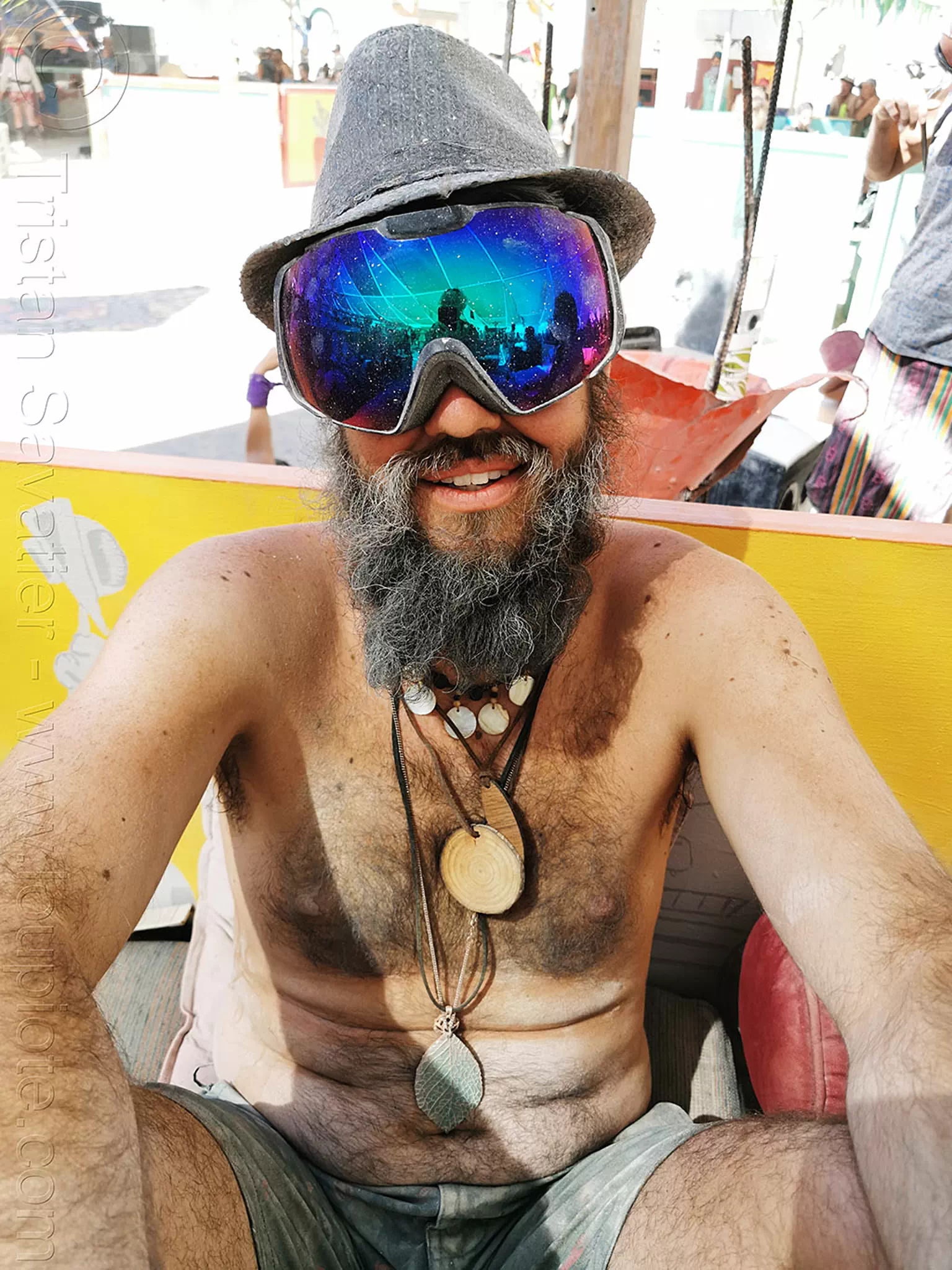 man with blue goggles at center camp - burning man 2019, bead, burning man, goggles, hat