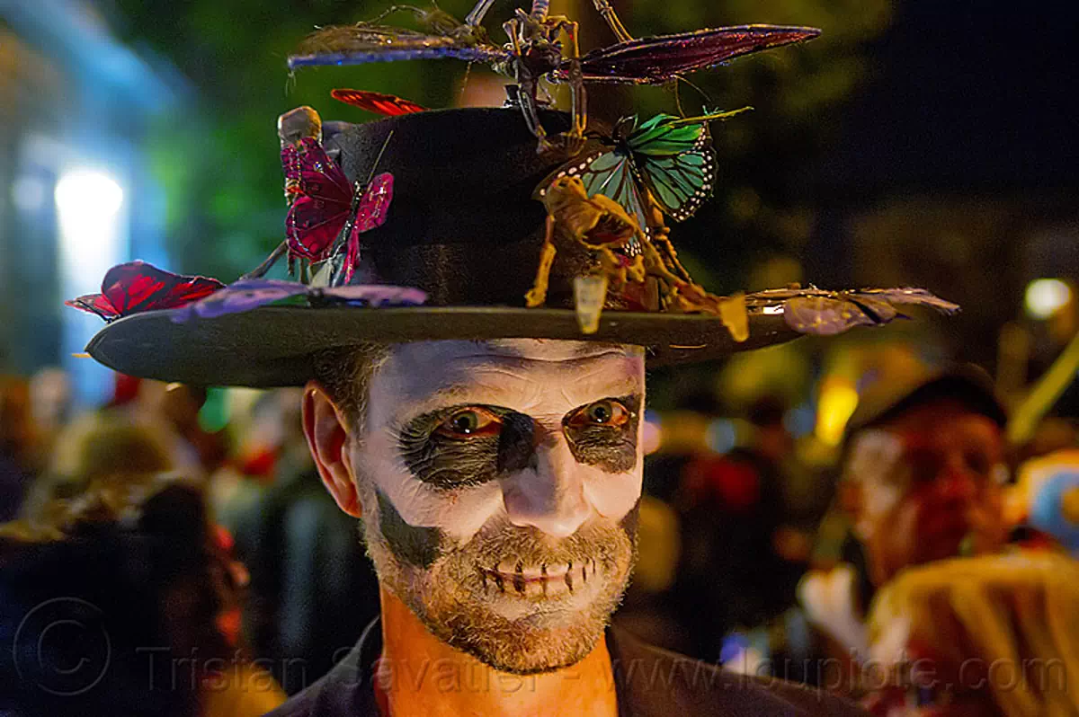 man with skull makeup and decorated hat, beard, butterflies, day of the dead, decorated hat, dia de los muertos, face painting, facepaint, halloween, man, night, skull makeup