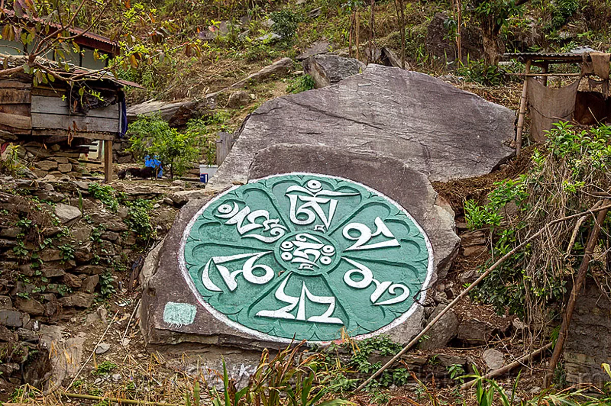 mandala carved on large rock, sikkim, india