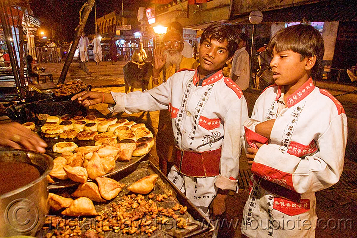 members of marching band buying samosas - orchha (india), boys, india, marching band, night, orchha, samosas, stall