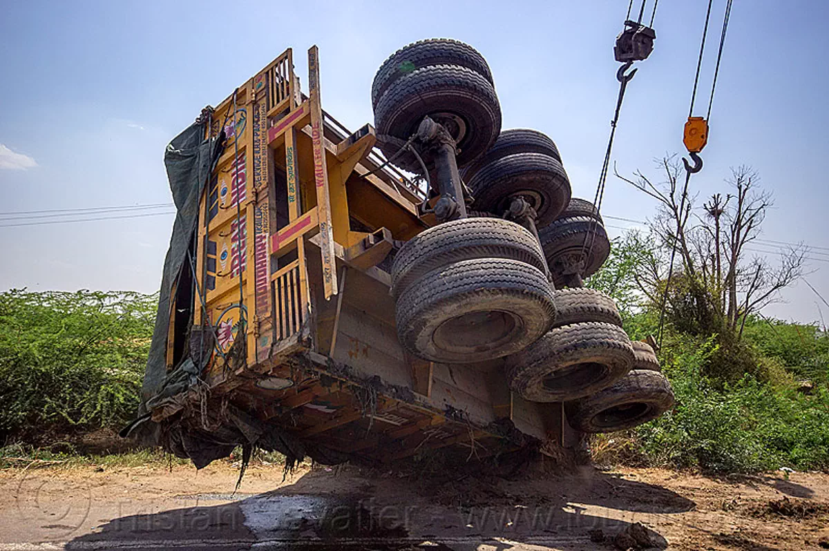 mobile cranes lift overturned semi-trailer truck (india), artic, articulated truck, cables, cranes, crash, hooks, india, overturned, road, semi-trailer, tata motors, tractor trailer, traffic accident, truck accident