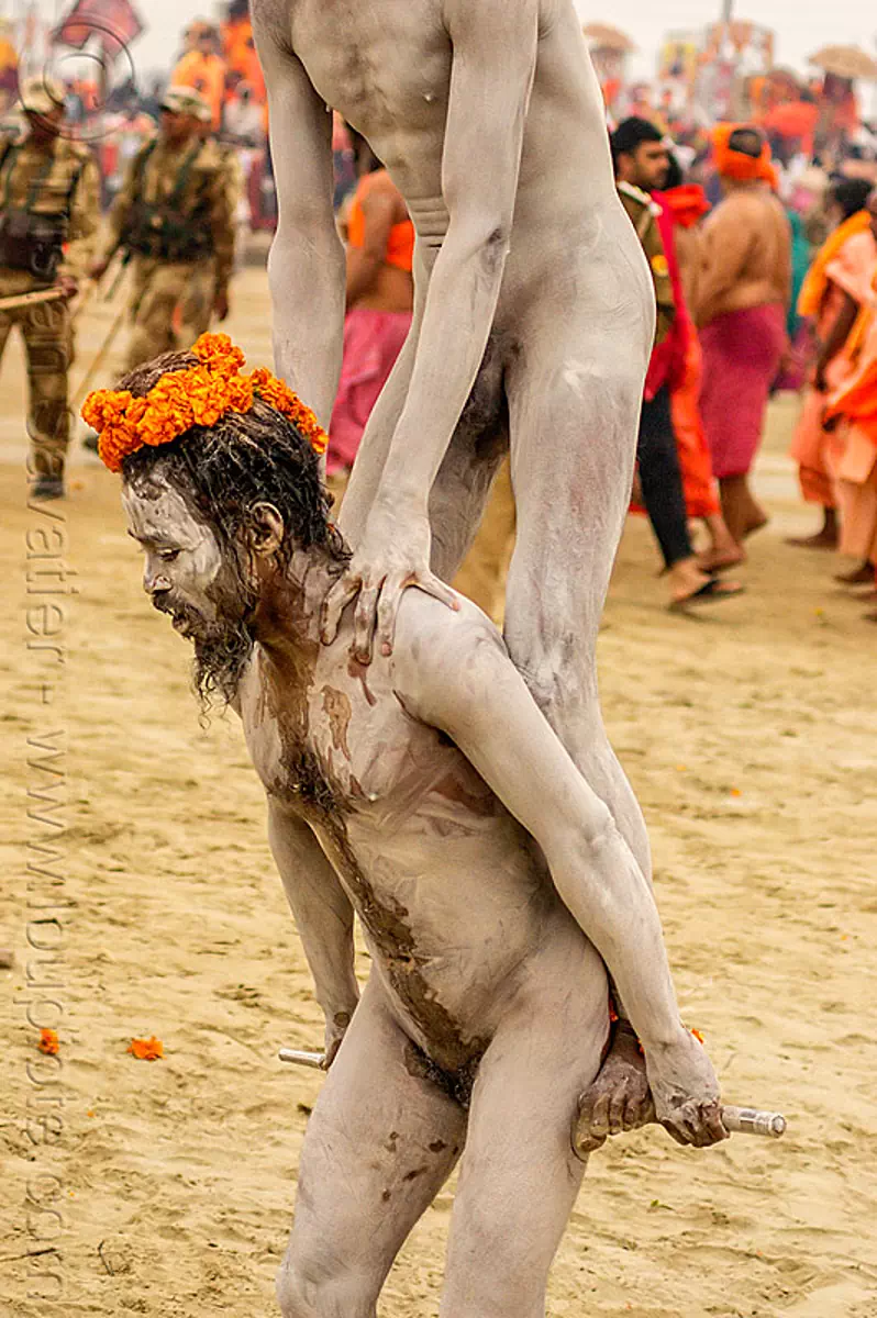 naga sadhus performing stick trick - kumbh mela 2013 (india), baba, hindu pilgrimage, hinduism, holy ash, kumbh mela, man, naga babas, naga sadhus, sacred ash, sadhu, stick, vibhuti, wrapped