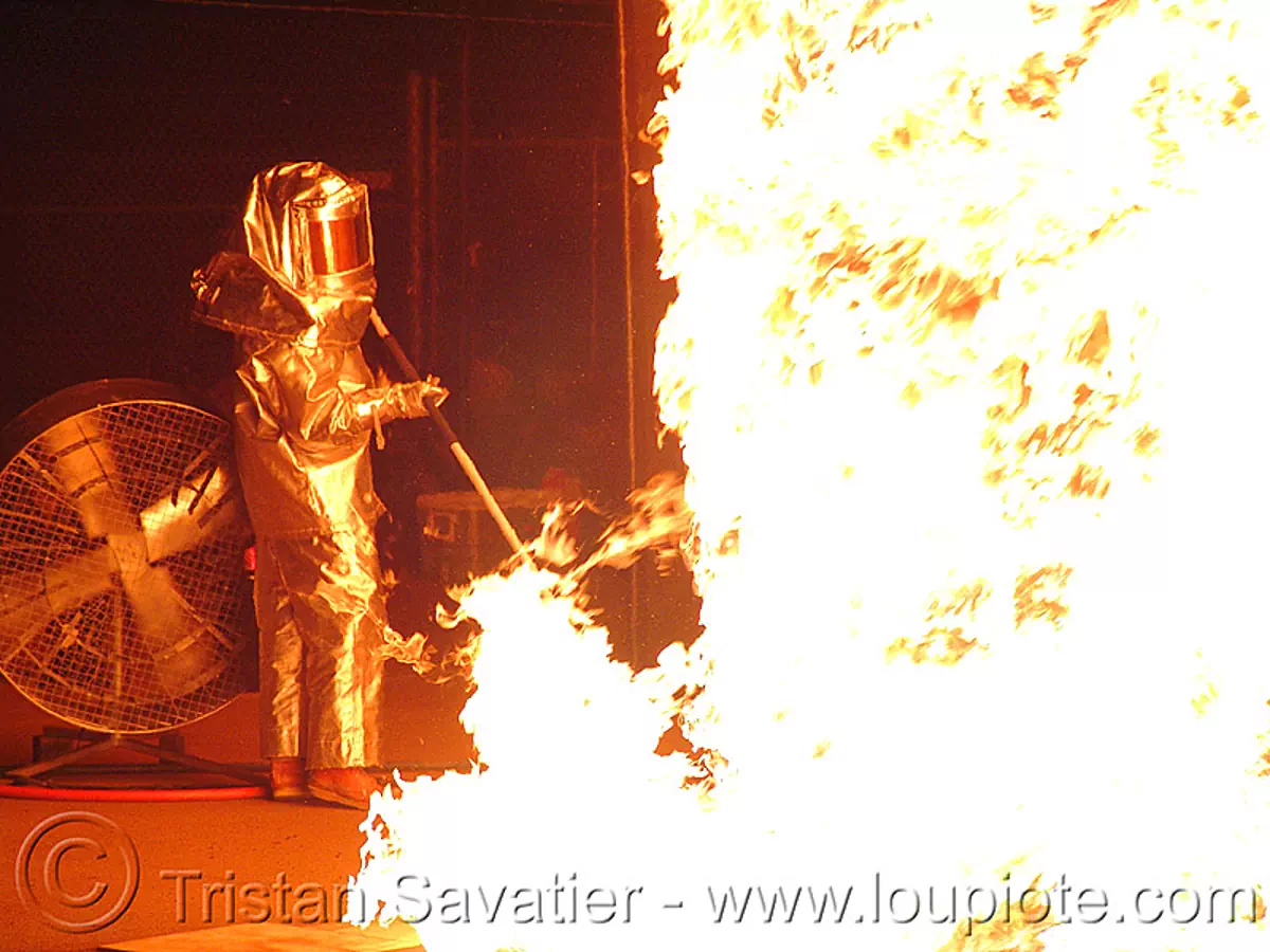 nate smith in his fire proximity suit, burning, fire art, fire proximity suit, fire resistant, firenado, flame resistant clothing, flame-resistant suit, fr, man, nate smith, pillar of fire, silver bunker suit