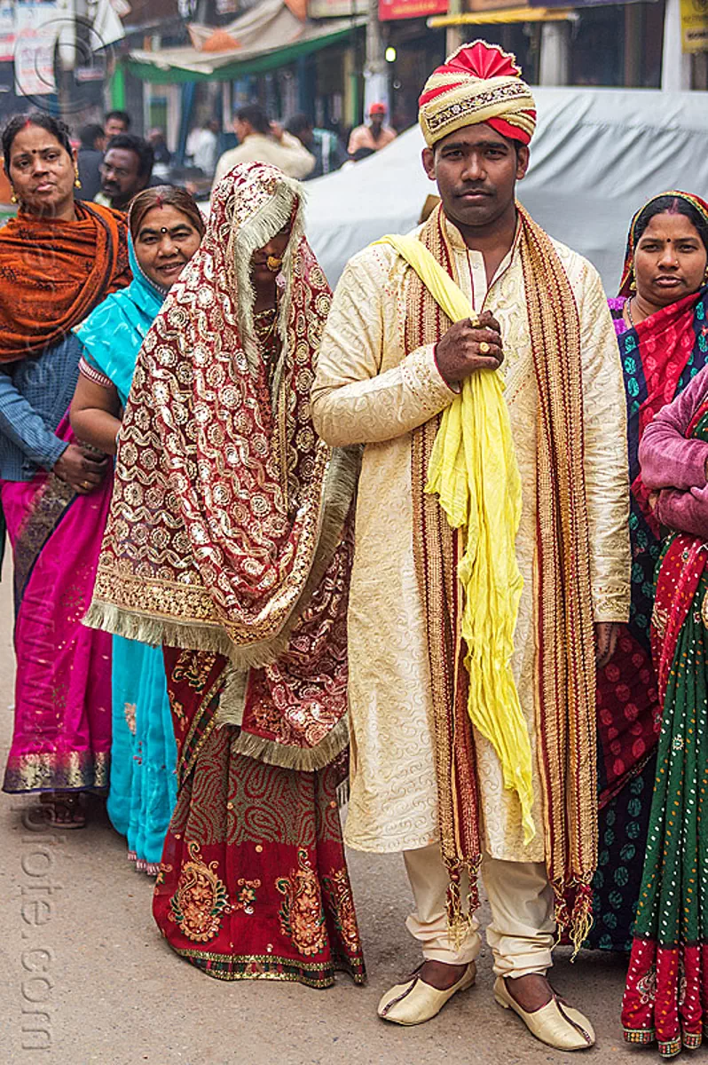 newlyweds - indian wedding - groom holding bride in tow like a trophy, bride, dressed-up, groom, headdress, indian wedding, indian woman, man, traditional, turban, varanasi, women