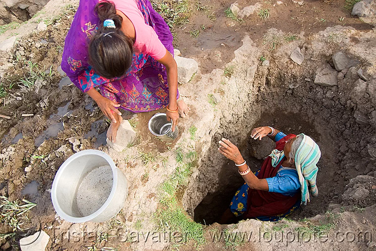 old woman getting drinking water from water hole - mandu (india), india, mandav, mandu, water hole, woman