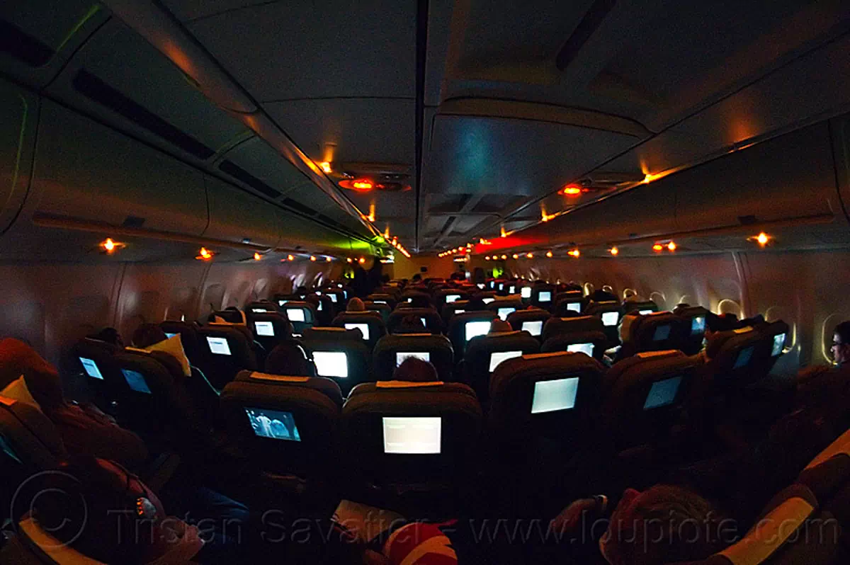 passenger cabin at night - airbus A340, airbus a340, flight lx-39, glowing, inside, interior, night, passenger cabin, passenger plane, swiss air, swiss international air lines, vanishing point, video screens