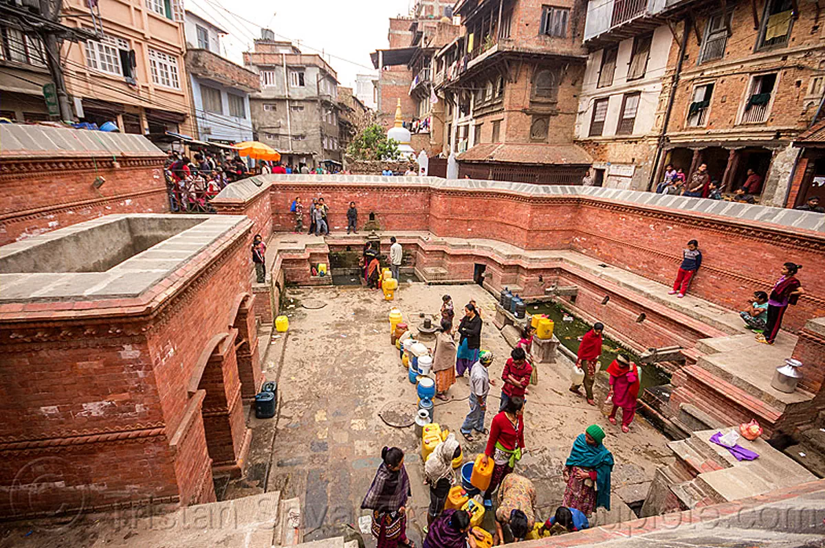 people getting water at old fountain in kathmandu, nepal 14349066146