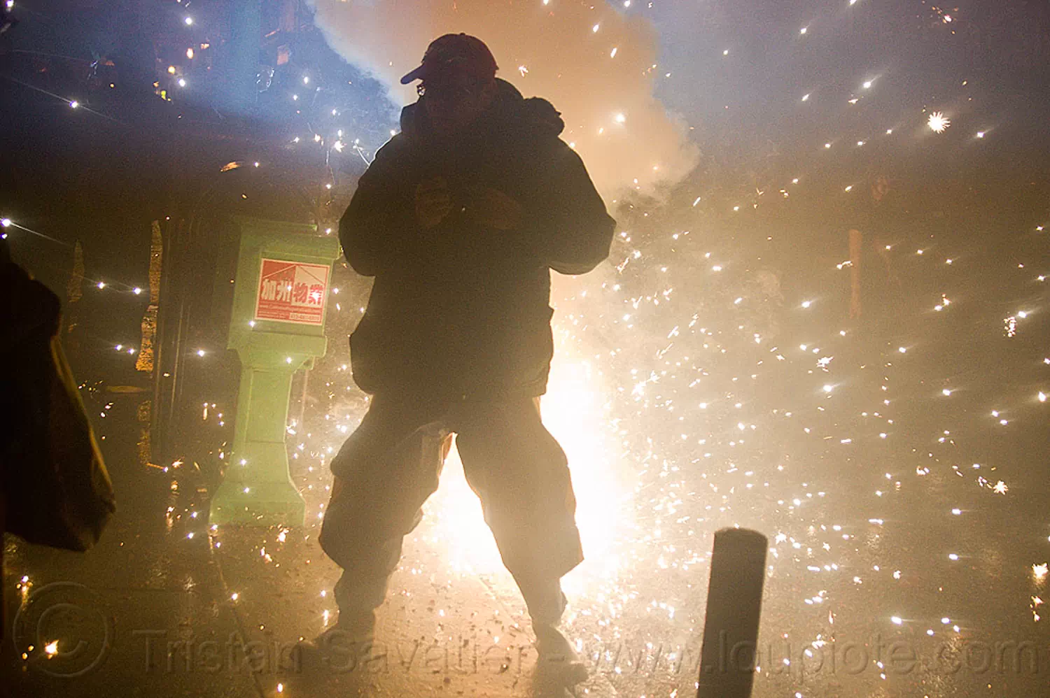 pyrotechnic explosion - chinese new year street celebration (san francisco), backlight, chinatown bang, chinese new year, explosion, firecrackers, lunar new year, man, night, pyrotechnics, silhouette, smoke, sparks