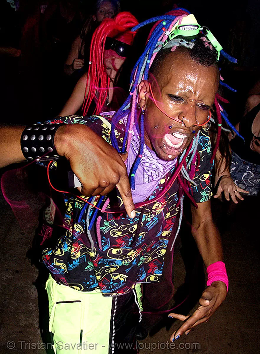 raver with EL-wire through septum piercing, african american man, black man, night, raver outfits