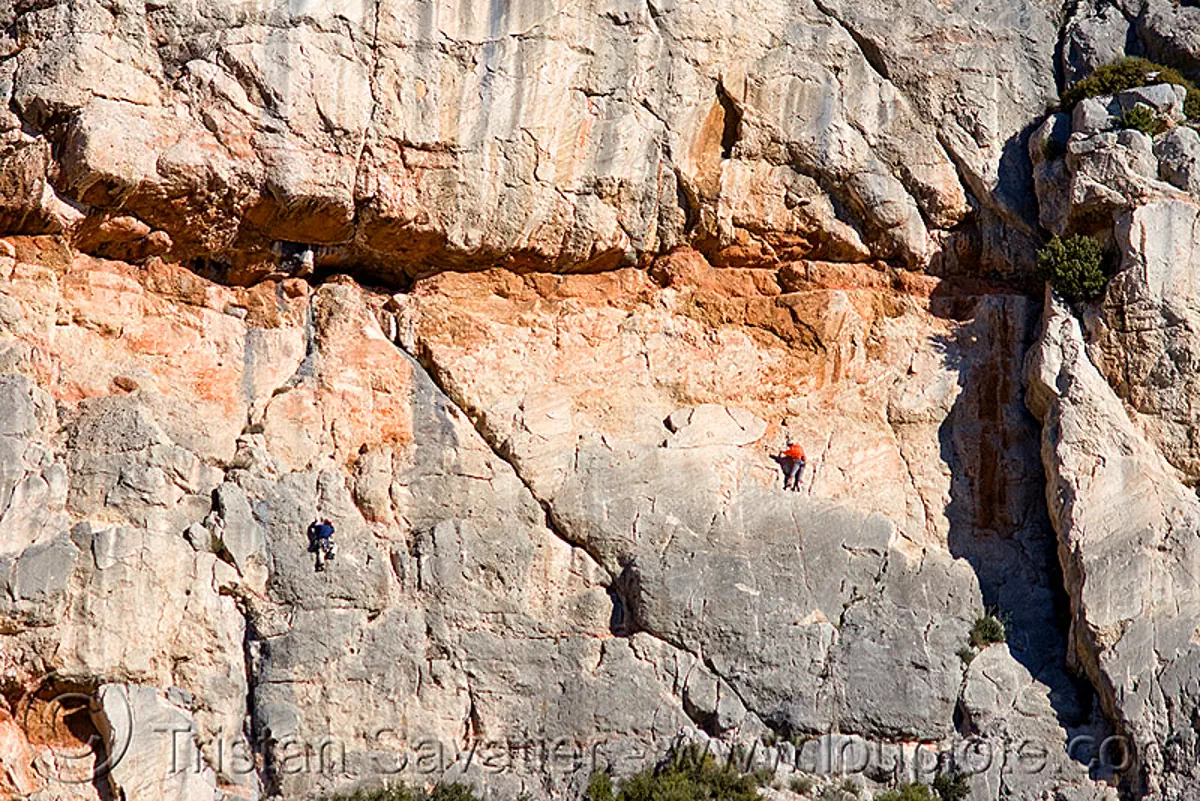 rock climbers on vertical cliff - montagne sainte victoire (france), aix-en-provence, france, montagne sainte victoire, mountain climbing, mountaineer, mountaineering, rock climbers, rock climbing, sheer cliff
