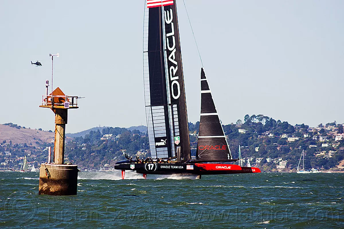 sailing hydrofoil catamaran oracle team USA near anita rock marker, san