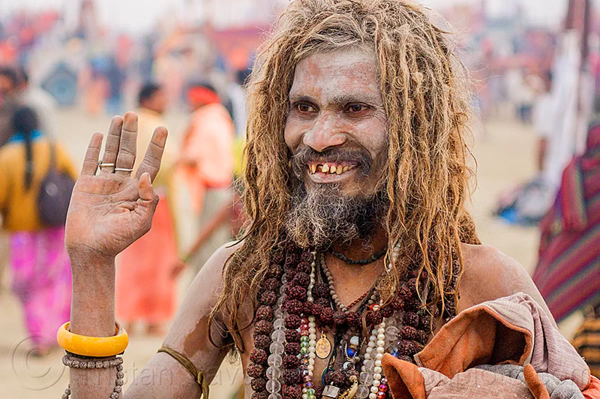 smiling sadhu covered with vibhuti sacred ash - hinduism (india), baba, bad teeth, beard, dreadlocks, hindu pilgrimage, hinduism, holy ash, kumbh mela, man, necklaces, rudraksha beads, sacred ash, sadhu, vibhuti