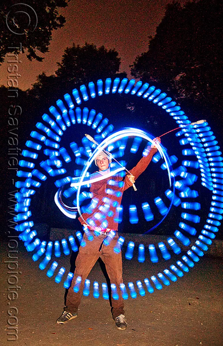 spinning blue LED light poi - flowlights (san francisco), fire dancer, fire dancing, fire performer, fire spinning, glowing, led lights, led poi, led staff, light poi, light staffs, nicky evers, night, spinning fire