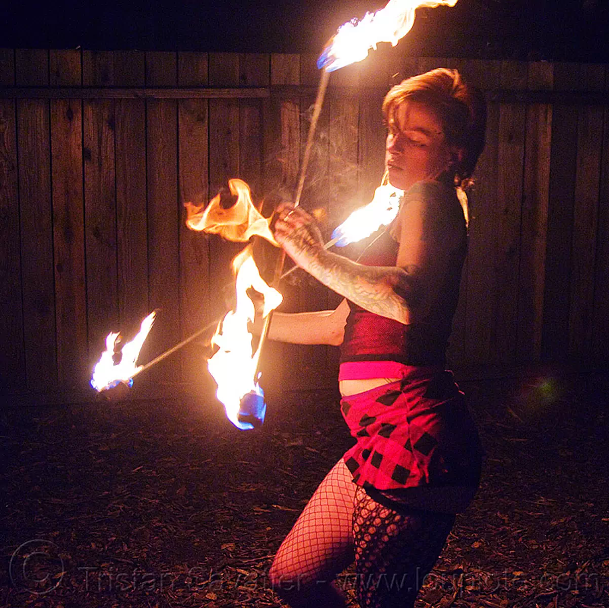 spinning fire staffs - leah, fire dancer, fire dancing, fire performer, fire spinning, fire staffs, fire staves, leah, night, woman