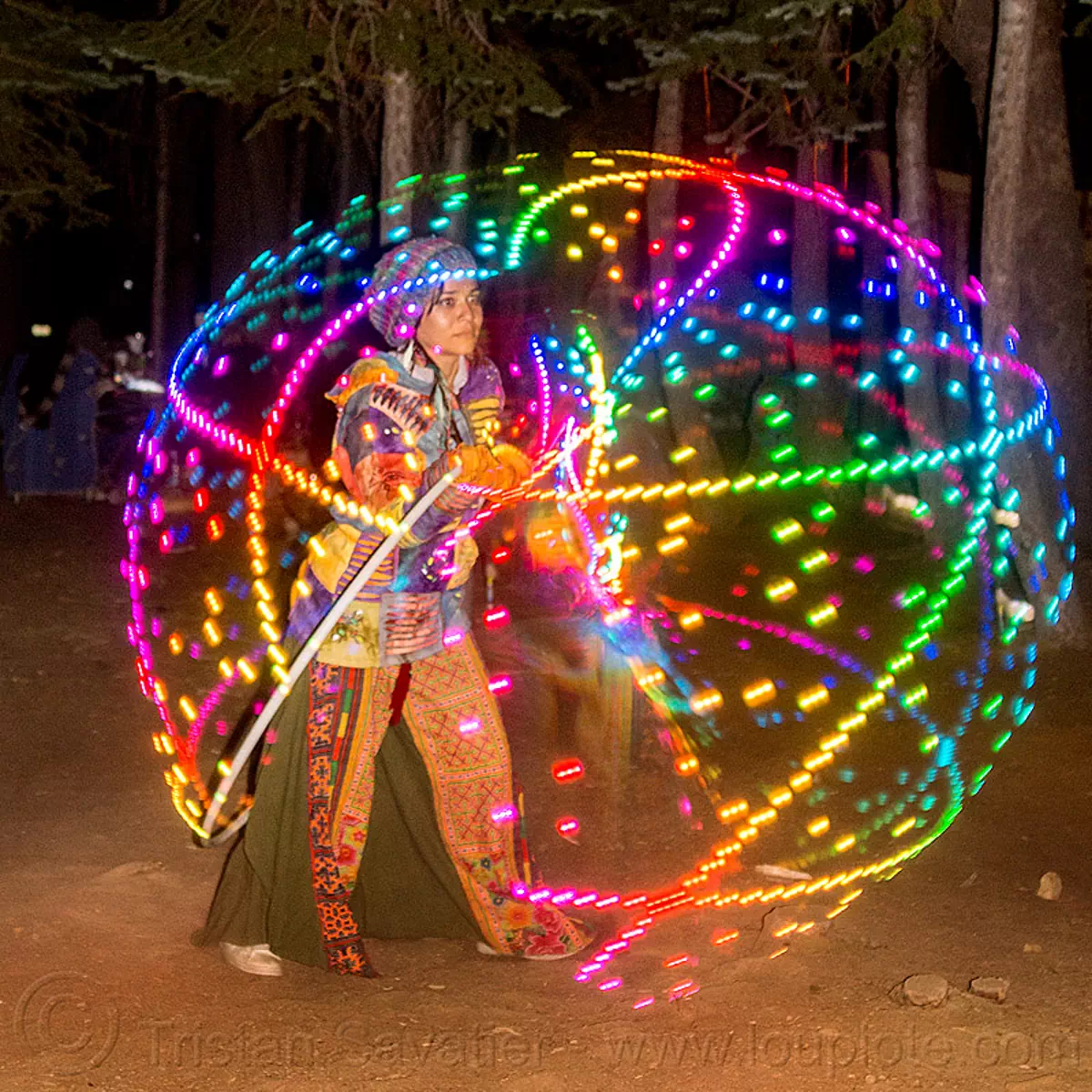 spinning a LED hulahoop, glowing, hooping, hulahoop, led hoop, led lights, light hoop, lotus maca moon, night, rainbow colors, star camp, woman