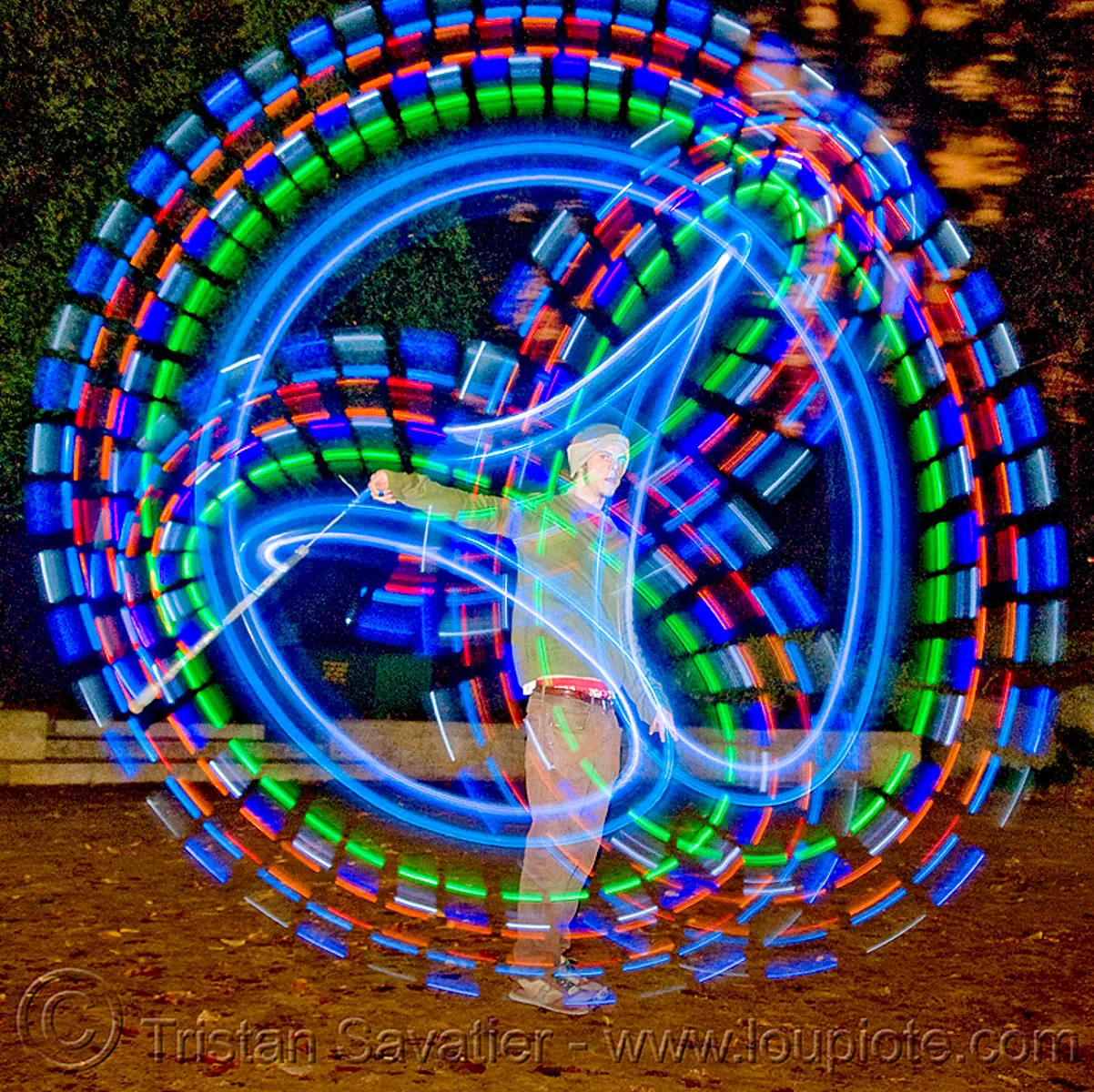 spinning LED light poi - glowing - flowlight, fire dancer, fire dancing, fire performer, fire spinning, glowing, led lights, led poi, light poi, man, nicky evers, night, spinning fire