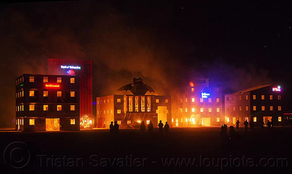 start of wall street fire - burning man 2012, buildings, burning man, corporate logos, fire, frogbat, night, wall street