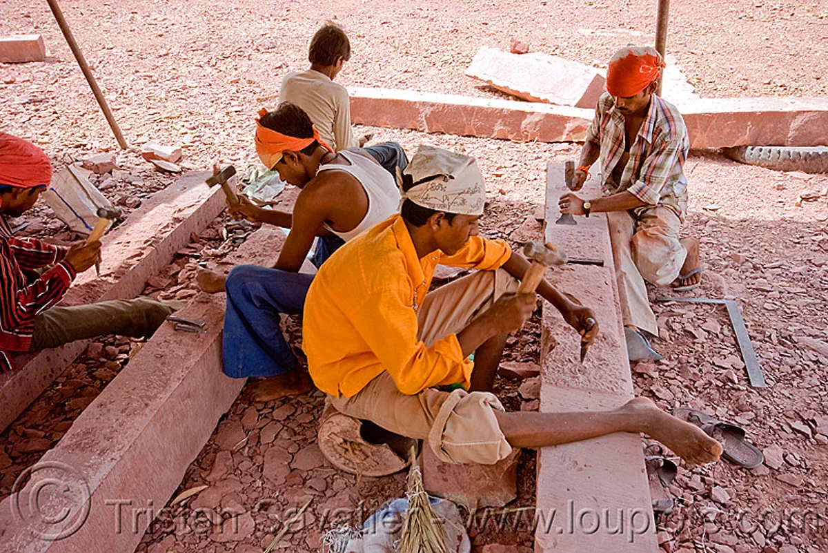 traditional stonemasons at work, palace restoration, india