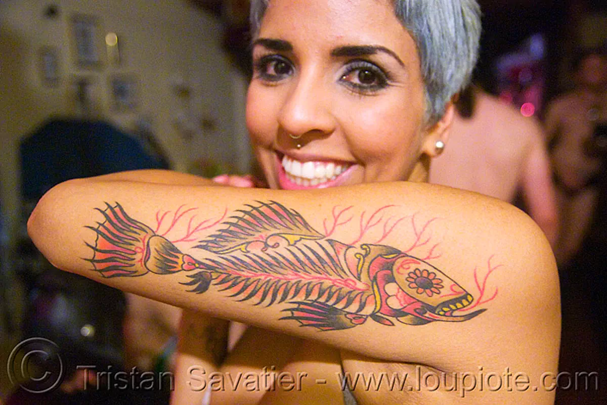 woman with fish tattoo on arm, arm tattoo, dia de los muertos, fish tattoo, mexican tattoo, tattooed, tattoos, woman