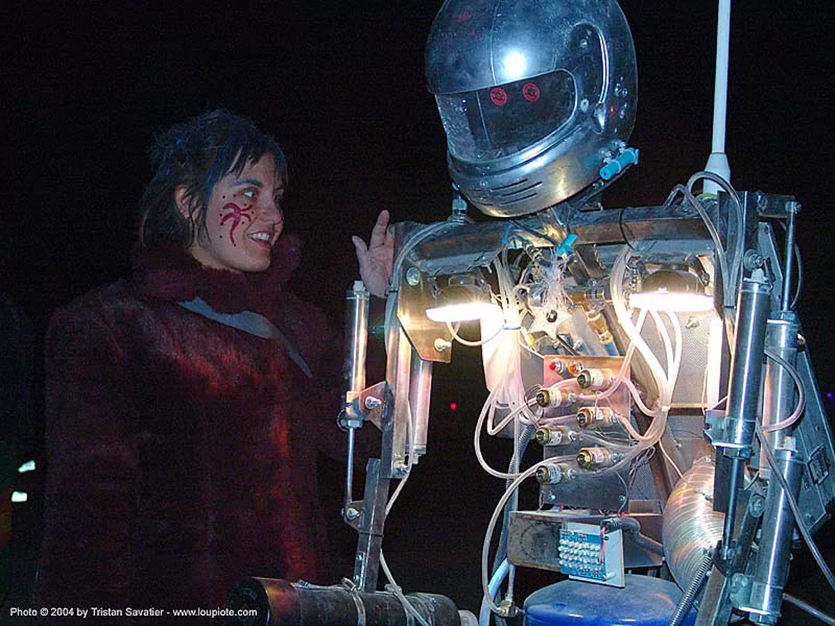 woman with hotshot the robot - burning man 2004, bot, burning man, hot shot, hotshot the robot, night, robotic