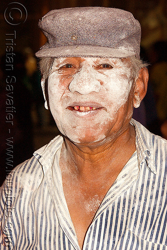 quechua man with talk powder on face carnaval carnival in jujuy