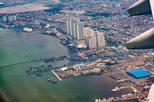 aerial view of the jakarta baywalk towers, a320, air asia, airbus, jakarta, passenger plane