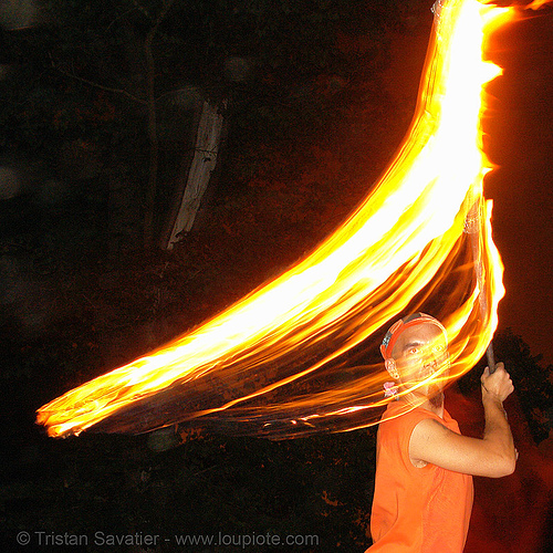 alex spinning a fire staff (san francisco), fire dancer, fire dancing, fire performer, fire spinning, fire staff, night, shanti alex, spinning fire