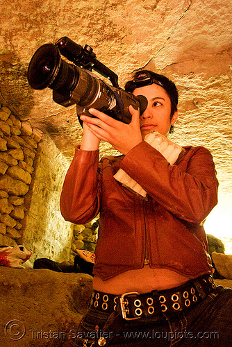 alyssa with video camera - catacombes de paris - catacombs of paris (off-limit area), camcorder, candles, cataphile, cave, clandestines, illegal, new year's eve, shooting, underground quarry, video camera, woman