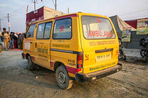ambulance of the red swastik society (india), ambulance, car, hindu pilgrimage, hinduism, kumbh mela, medics, minibus, paramedics, red swastik society, swastika, van, yellow