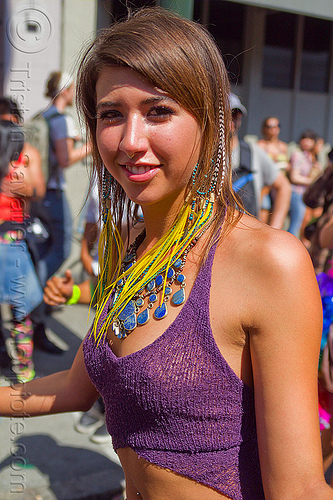 ariana - yellow feather earrings, ariana, blue stone necklace, dancing, feather earrings, gay pride festival, woman, yellow feathers