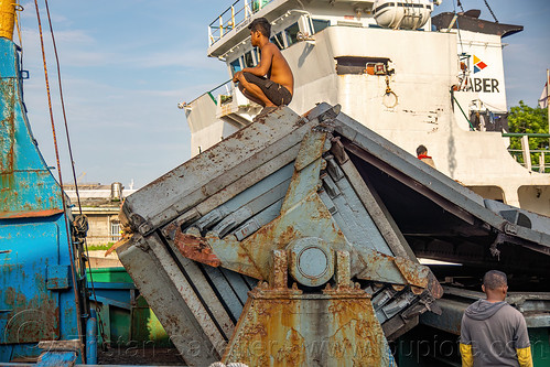 articulated hatch cover on small cargo ship, boat, cargo ship, dock, harbor, harbour, man, merchant ship, surabaya