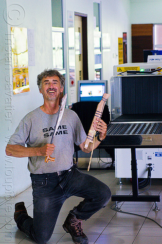 bad airport screening - air travel safety, airport lobby, borneo, gunung mulu national park, knife, machete holder, malaysia, man, mulu airport, penan, security breach, security check, security checkpoint, selfie, selfportrait, weapon, x-ray machine