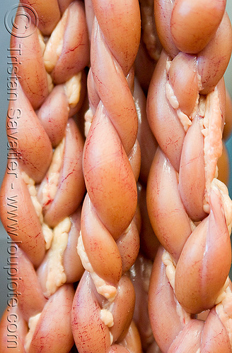 beef intestines in meat shop - braided (argentina), argentina, beef, braid, braided, butcher, closeup, guts, intestines, meat market, meat shop, mercado central, noroeste argentino, raw meat, salta