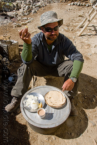 ben having breakfast at pangong lake - ladakh (india), ben, breakfast, chai, chapati, india, ladakh, milk tea, spangmik, spice tea